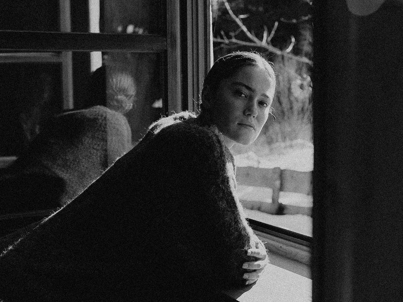 portrait of a woman edited with Ilford HP5 Plus 400 film emulation preset — punchy black and white contrast